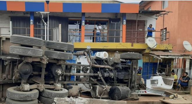 Trailer Crashes Into Shops